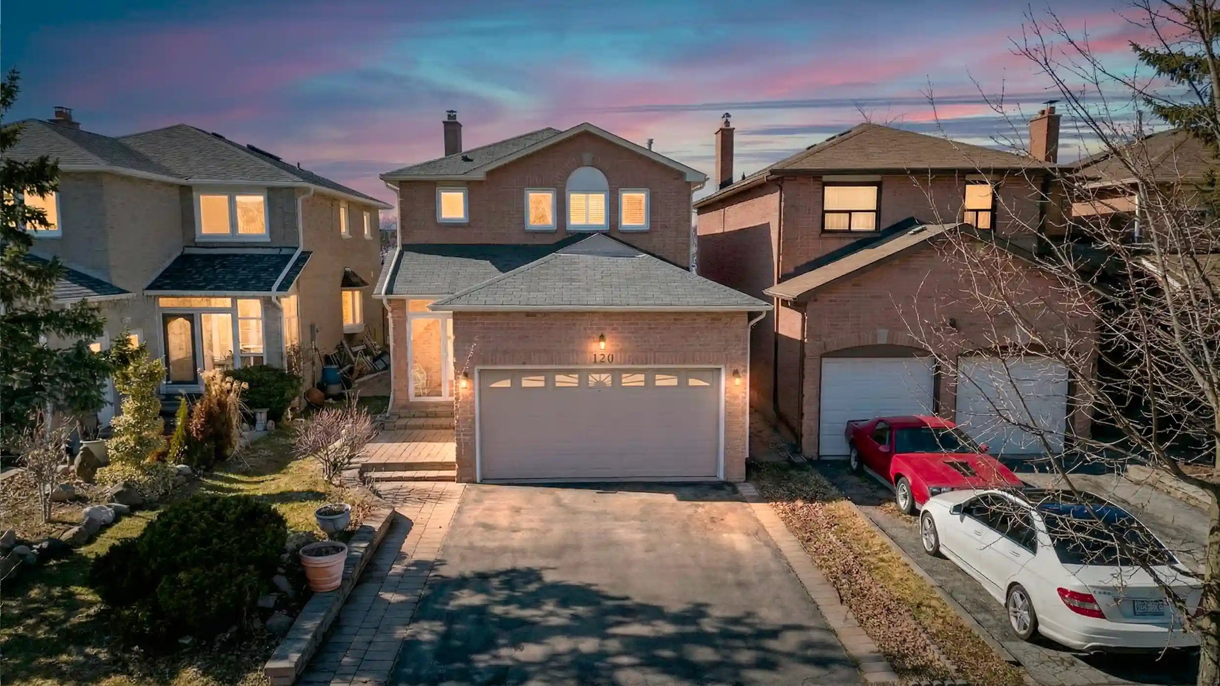 Twilight exterior photograph of a Real Frames listing
